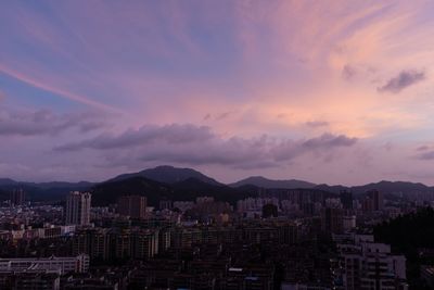 High angle view of buildings against sky at sunset
