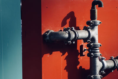 Close-up of pipes against wall