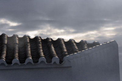 Low angle view of roof against sky