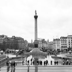 Group of people in front of buildings