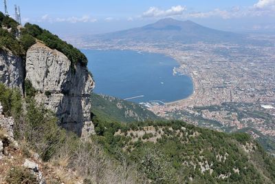 High angle view of landscape and sea against sky