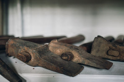 Close-up of rusty metal on wooden surface