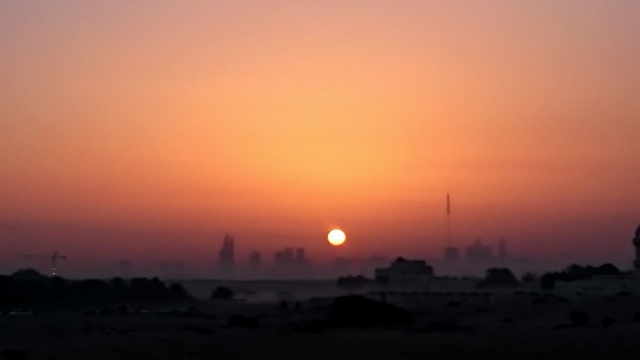 SILHOUETTE OF CITY AT SUNSET