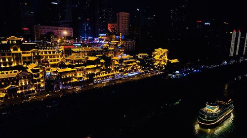 High angle view of illuminated buildings in city at night