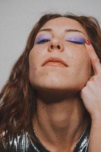 Portrait of young woman with eye make-up