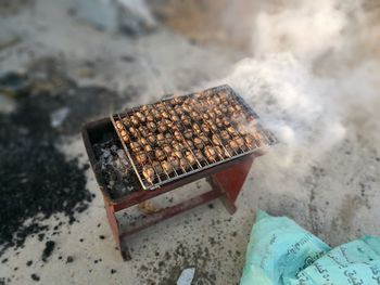 High angle view of meat on barbecue grill