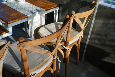 High angle view of chairs on table