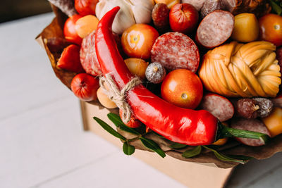 Delicious edible bouquet of sausage, tomatoes, cheese. gift for man.