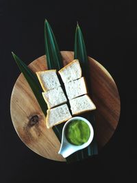 High angle view of food on table against black background