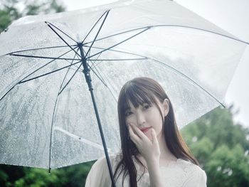 Portrait of a young woman standing outdoors