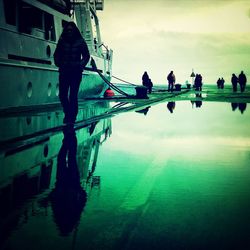 Reflection of woman in water