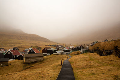 Scenic view of misty village of faroe islands