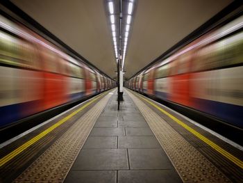 Blurred motion of trains at railroad station