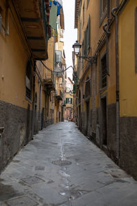 Narrow alley amidst buildings in city