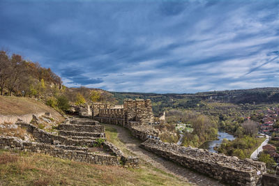 View of old ruins against cloudy sky