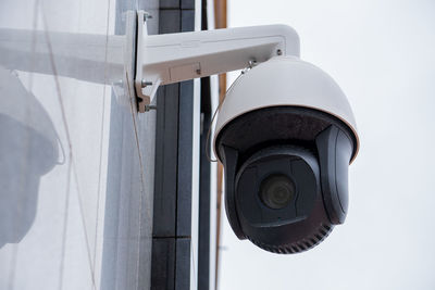 Video surveillance - surveillance camera on the wall of an office building