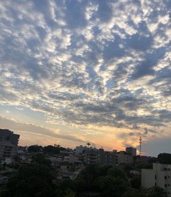 High angle view of buildings against sky at sunset