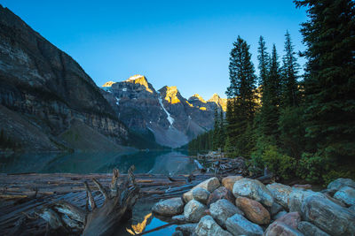 Scenic view of mountains against clear blue sky