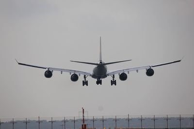 Low angle view of airplane flying in sky
