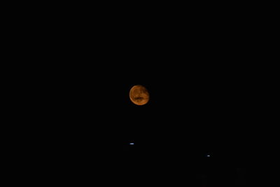 Scenic view of moon against clear sky at night