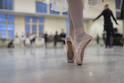 Low section of ballet dancer dancing in studio