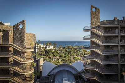 Panoramic view of sea and buildings against clear sky