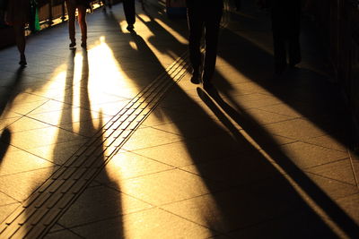 Low section of people walking on footpath