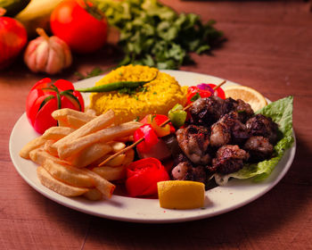Close-up of fruits served in plate on table
