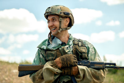 Army soldier holding gun