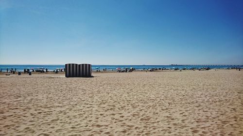 Scenic view of beach against clear sky