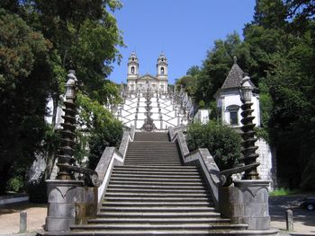 Low angle view of staircase by building against clear sky