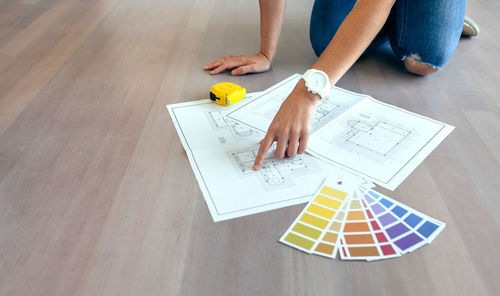 Low section of woman on table