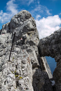 Low angle view of rock formation against sky