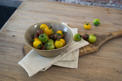 High angle view of cherry tomatoes on table