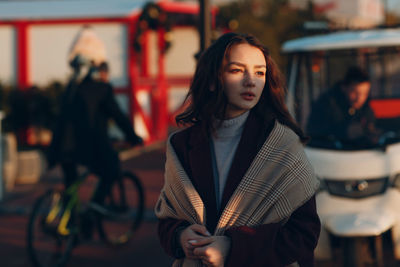 Beautiful young woman standing at home