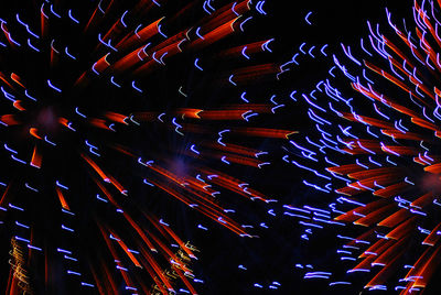 Low angle view of light trails at night