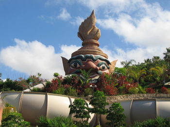 Statue of temple against cloudy sky