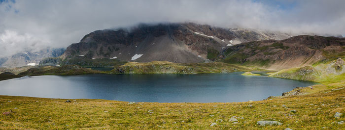 Panoramic view of lake against mountains at gran paradiso national park