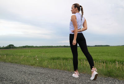 Full length of man standing on field