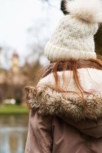 Rear view of woman wearing hat during winter