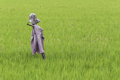 Woman standing in field