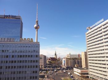 View of cityscape against blue sky