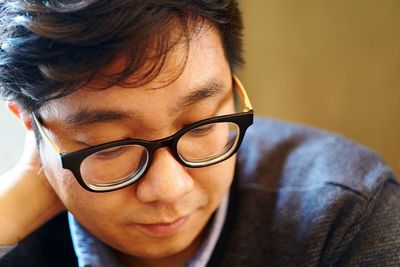 Close-up of young man with eyeglasses