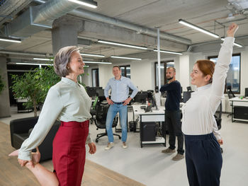 Low angle view of business people walking at airport