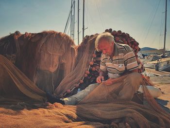 Panoramic shot of people on land against sky