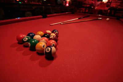 Pool balls on red table