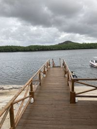 Pier over lake against sky