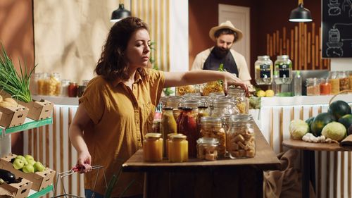 Side view of woman preparing food at home