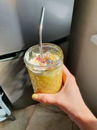 High angle view of hand holding drink