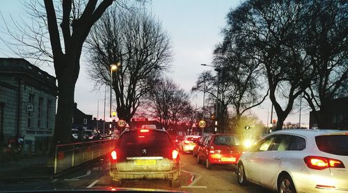 Cars on road in city at night